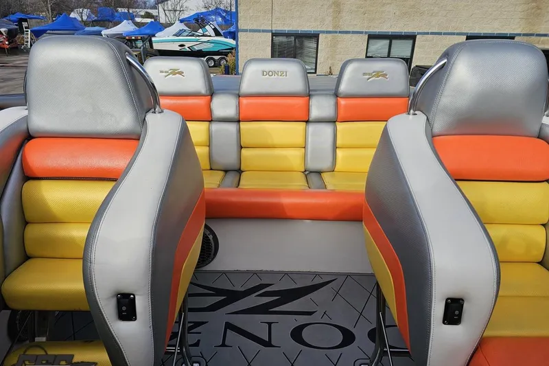 Slide: The Image of Interior of a 2007 Donzi 38 ZR boat with colorful seating. - 112