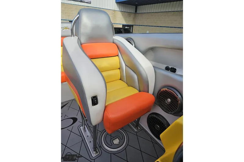 Slide: The Image of 2007 Donzi 38 ZR boat seat with vibrant orange and yellow upholstery. - 113
