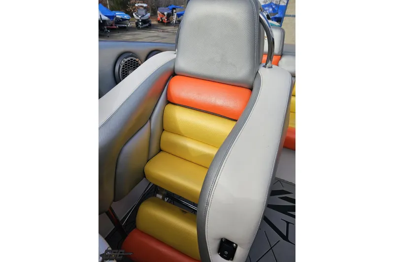 Slide: The Image of 2007 Donzi 38 ZR boat seat with vibrant orange and yellow upholstery. - 116