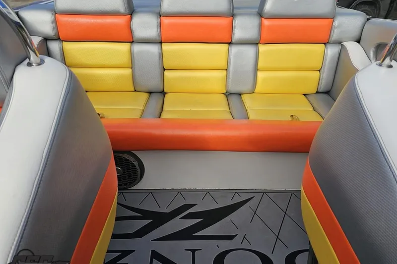 Slide: The Image of 2007 Donzi 38 ZR boat interior with colorful seating and logo floor mat. - 117