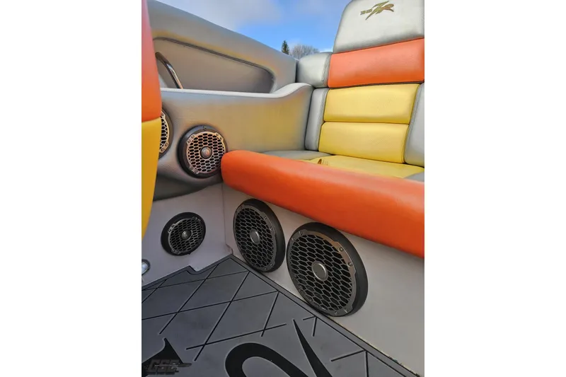 Slide: The Image of 2007 Donzi 38 ZR boat interior with vibrant seating and built-in speakers. - 118