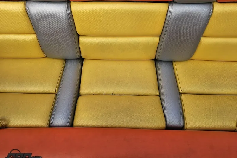 Slide: The Image of Yellow and gray seating of a 2007 Donzi 38 ZR boat. - 119