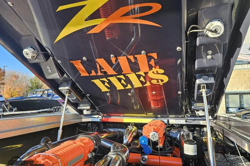 Slide: The Image of 2007 Donzi 38 ZR boat engine compartment with "Late Fee$" decal on the hatch. - 123