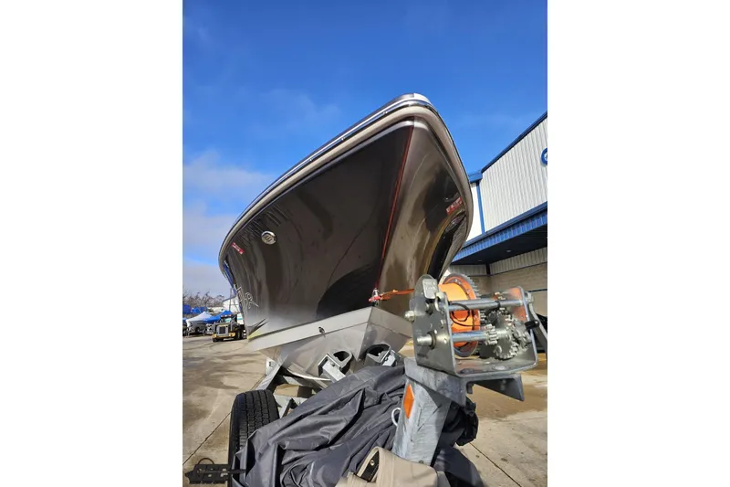 Slide: The Image of 2007 Donzi 38 ZR boat on trailer, viewed from below, against blue sky. - 16
