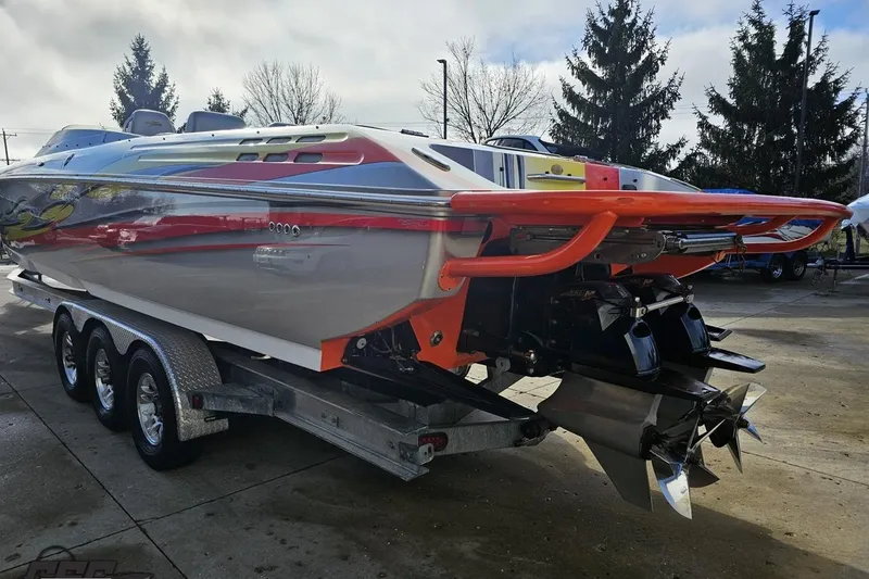 Slide: The Image of 2007 Donzi 38 ZR speedboat on trailer, showcasing sleek design and powerful engines. - 27