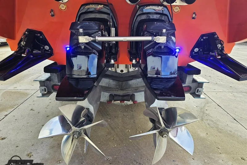 Slide: The Image of Rear view of 2007 Donzi 38 ZR boat with dual propellers and orange hull. - 30