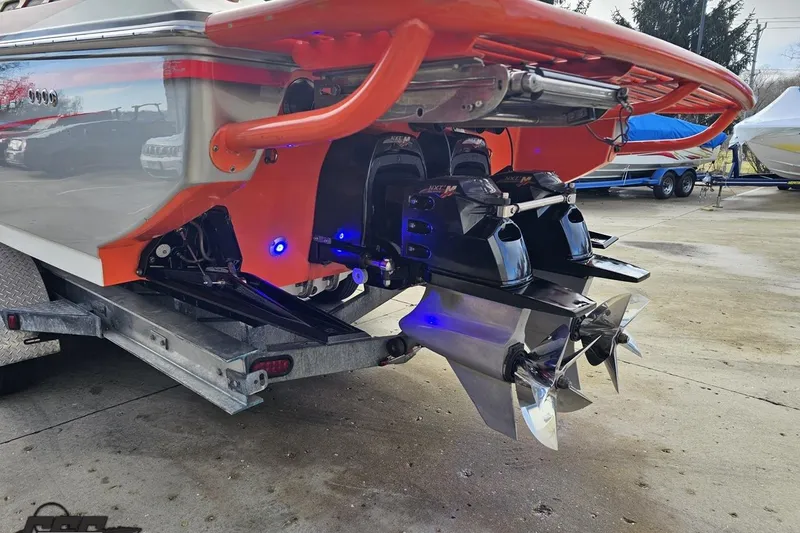 Slide: The Image of 2007 Donzi 38 ZR boat with dual propellers and vibrant orange detailing. - 31