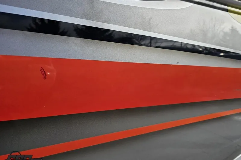 Slide: The Image of 2007 Donzi 38 ZR boat with sleek red and gray exterior design. - 37
