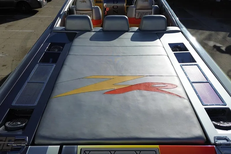 Slide: The Image of 2007 Donzi 38 ZR boat interior with logo, featuring sleek seating and modern design. - 42