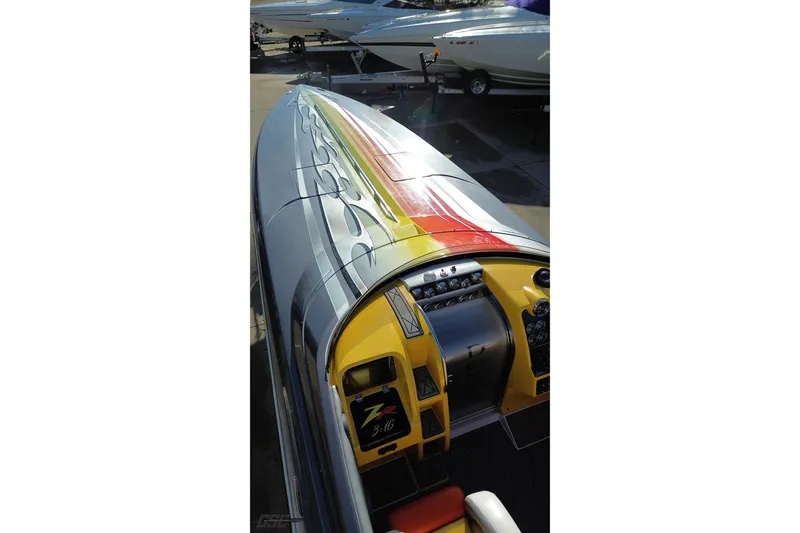 Slide: The Image of 2007 Donzi 38 ZR speedboat with vibrant graphics and sleek design. - 46