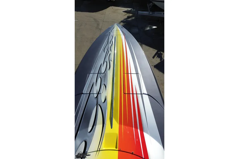 Slide: The Image of 2007 Donzi 38 ZR boat with vibrant, colorful graphics on the deck. - 47