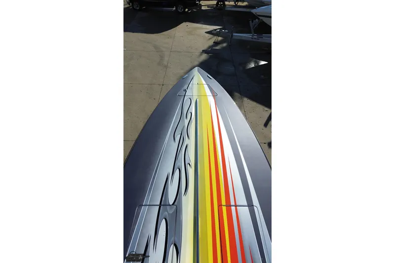 Slide: The Image of 2007 Donzi 38 ZR boat with vibrant flame graphics on deck. - 48
