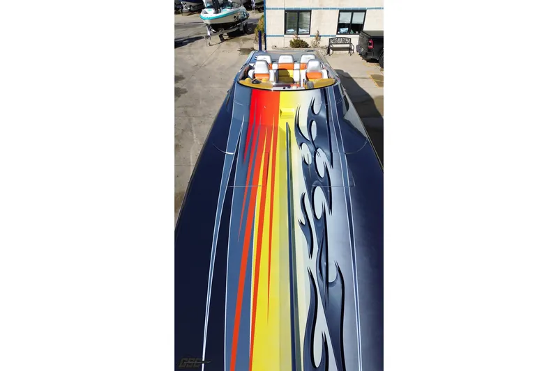 Slide: The Image of 2007 Donzi 38 ZR speedboat with vibrant flame graphics on deck. - 51