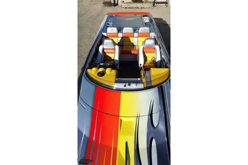 Slide: The Image of 2007 Donzi 38 ZR speedboat with vibrant, colorful design and sleek seating arrangement. - 52