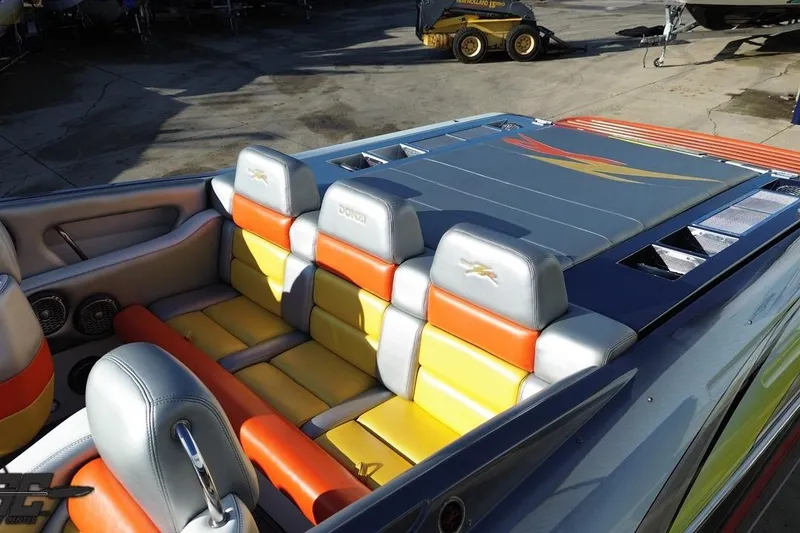 Slide: The Image of 2007 Donzi 38 ZR boat interior with colorful seating and sleek design. - 54