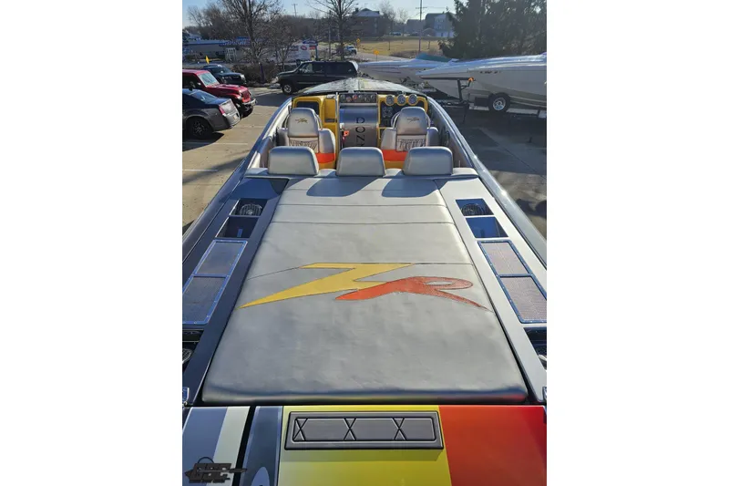 Slide: The Image of 2007 Donzi 38 ZR speedboat with sleek design and vibrant interior, parked outdoors. - 57