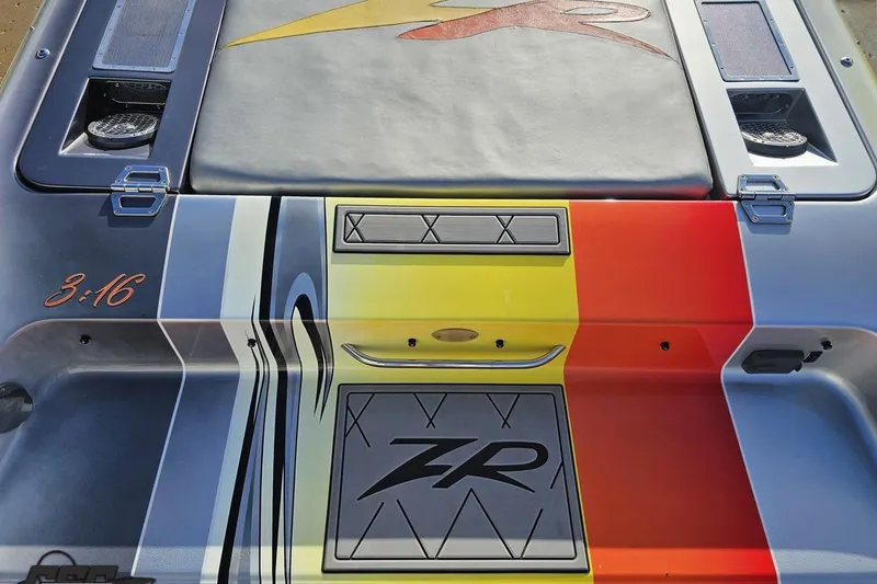 Slide: The Image of 2007 Donzi 38 ZR boat with colorful deck design and sleek graphics. - 58