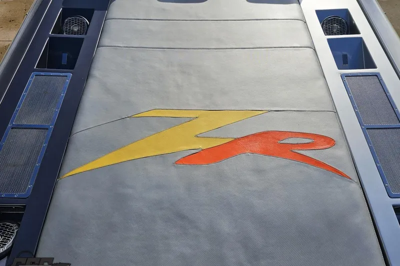 Slide: The Image of 2007 Donzi 38 ZR boat engine cover with colorful logo design. - 60