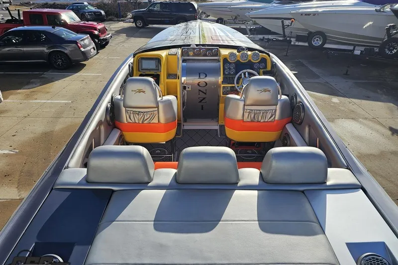 Slide: The Image of 2007 Donzi 38 ZR boat interior with vibrant seating and detailed dashboard. - 61