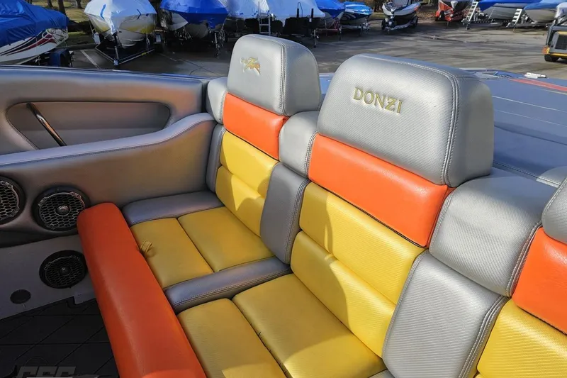 Slide: The Image of 2007 Donzi 38 ZR boat interior with colorful seating and branded headrests. - 70