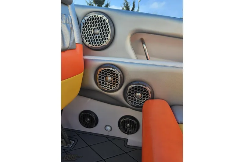 Slide: The Image of Interior of 2007 Donzi 38 ZR boat with multiple speakers and vibrant seating. - 72
