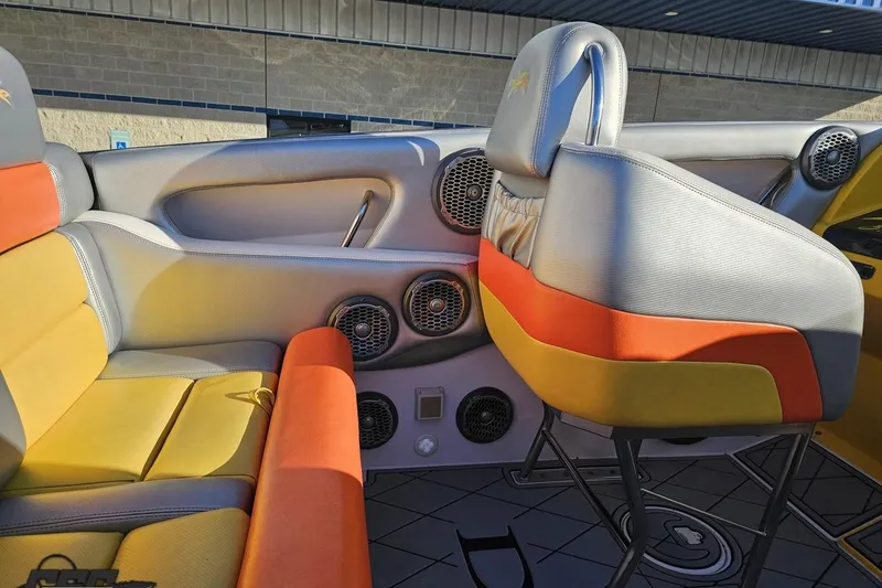 Slide: The Image of Interior of a 2007 Donzi 38 ZR boat with colorful seating and audio speakers. - 74