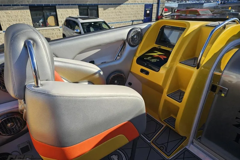 Slide: The Image of Interior of a 2007 Donzi 38 ZR boat with vibrant yellow dashboard. - 76