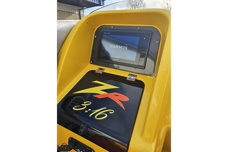 Slide: The Image of Dashboard of a 2007 Donzi 38 ZR boat with Garmin navigation system. - 77