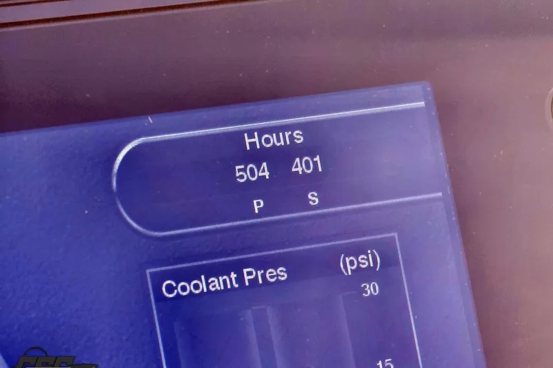 Slide: The Image of Dashboard display showing engine hours and coolant pressure for 2007 Donzi 38 ZR boat. - 86