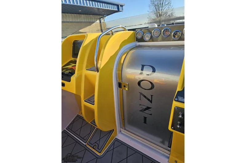 Slide: The Image of 2007 Donzi 38 ZR boat interior with yellow accents and dashboard gauges. - 88