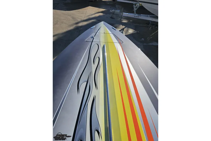 Slide: The Image of 2007 Donzi 38 ZR boat with vibrant flame graphics on the deck. - 93