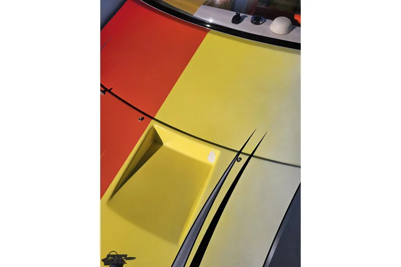 Slide: The Image of 2007 Donzi 38 ZR boat with vibrant red and yellow deck design. - 95
