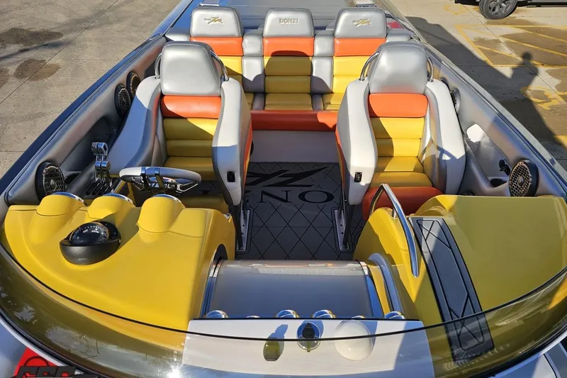 Slide: The Image of 2007 Donzi 38 ZR boat interior with vibrant yellow and orange seating. - 96