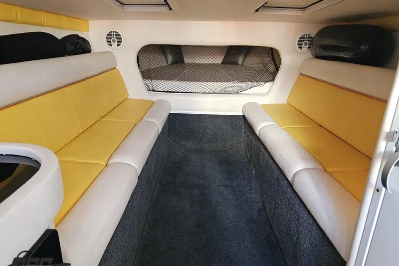 Slide: The Image of Interior of 2007 Donzi 38 ZR boat with yellow and white seating. - 98