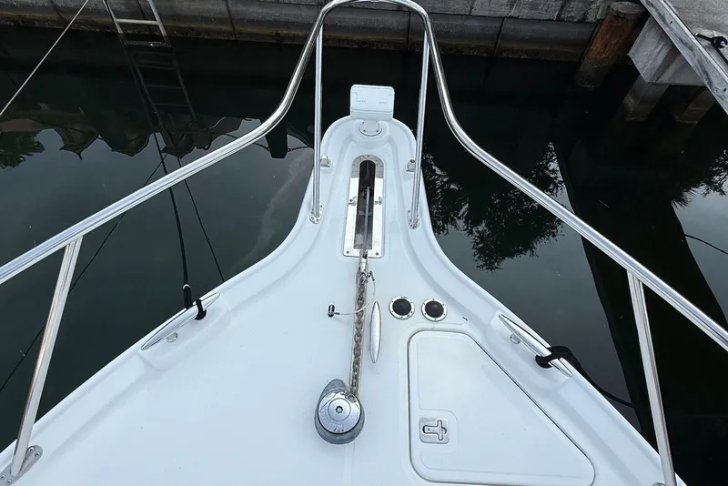 Slide: The Image of Bow of 2004 Tiara Yachts 3600 Sovran with anchor and railing in marina. - 20