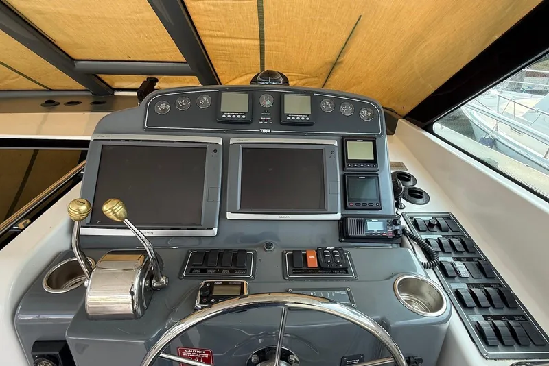 Slide: The Image of Helm of 2004 Tiara Yachts 3600 Sovran with navigation and control systems. - 25