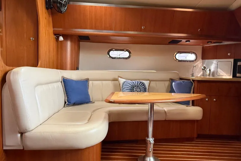 Slide: The Image of Interior of 2004 Tiara Yachts 3600 Sovran with elegant seating and wooden finishes. - 28