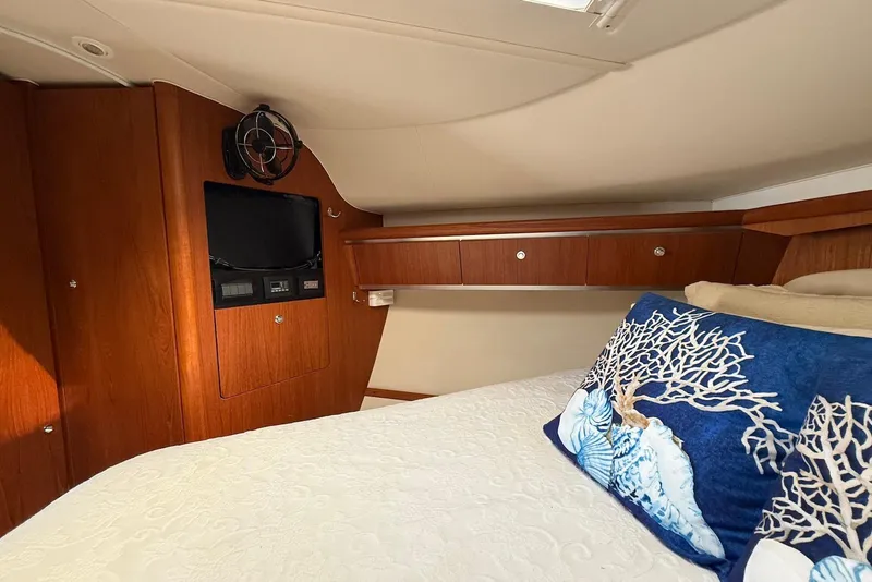Slide: The Image of Luxurious cabin interior of 2004 Tiara Yachts 3600 Sovran with elegant wood finish. - 37