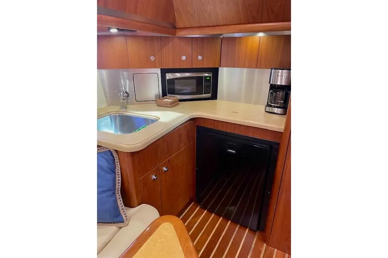 Slide: The Image of 2004 Tiara Yachts 3600 Sovran galley with sink, microwave, and coffee maker. - 39