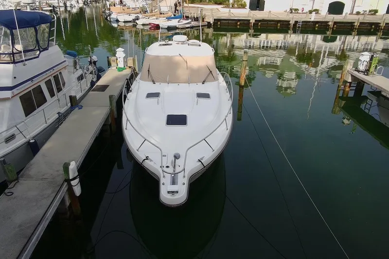 Slide: The Image of 2004 Tiara Yachts 3600 Sovran docked in a marina, aerial view. - 4