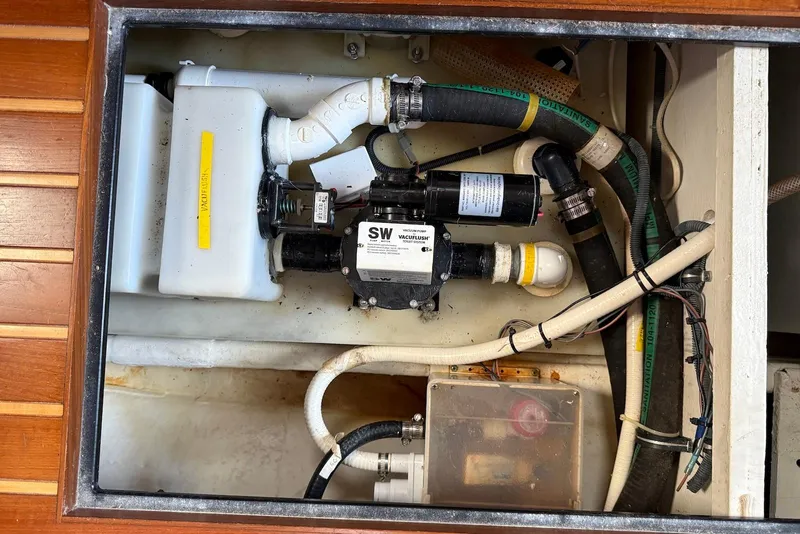 Slide: The Image of Engine compartment of 2004 Tiara Yachts 3600 Sovran with plumbing and pump system. - 47