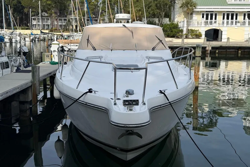 Slide: The Image of 2004 Tiara Yachts 3600 Sovran docked at a marina, front view. - 7