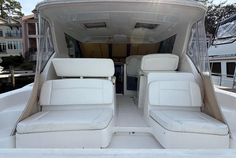 Slide: The Image of 2004 Tiara Yachts 3600 Sovran interior with white seating and spacious layout. - 8