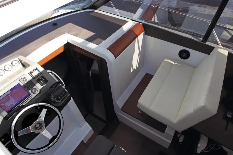 Slide: The Image of Manufacturer Provided Image: 2018 Jeanneau NC 9 boat cockpit with steering wheel and navigation system. - 17