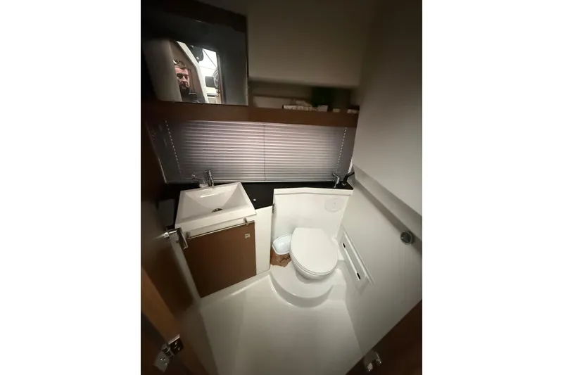 Slide: The Image of 2019 Jeanneau NC 9 boat bathroom with modern sink and toilet. - 6