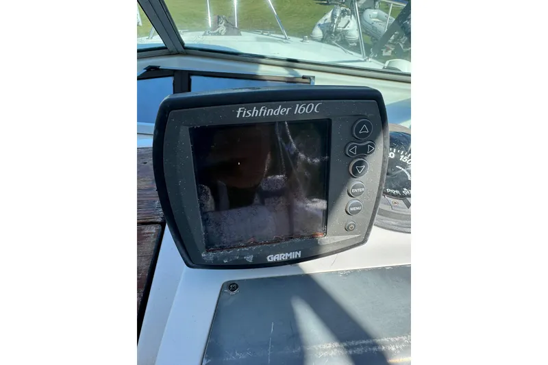 Slide: The Image of Garmin Fishfinder 160C on 1988 Chris-Craft 215 Sea Hawk dashboard. - 26
