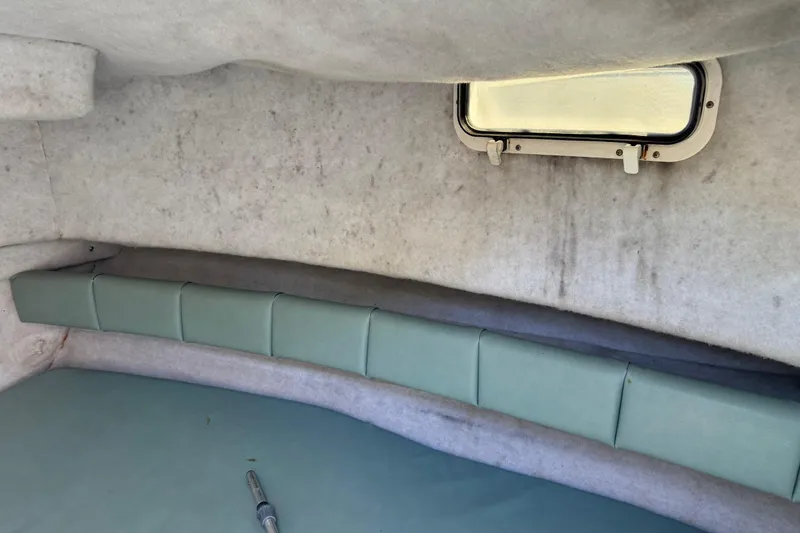 Slide: The Image of Interior cabin of 1988 Chris-Craft 215 Sea Hawk boat with window and seating. - 38