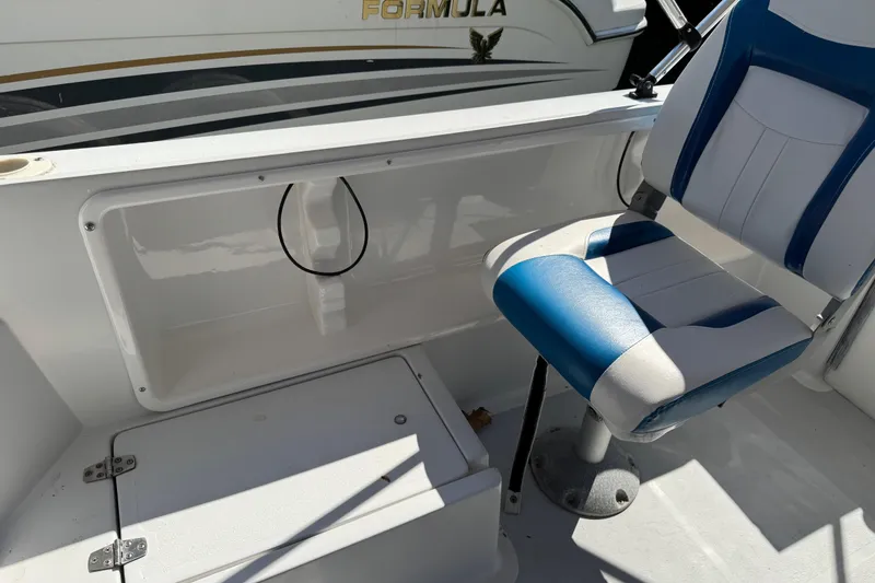 Slide: The Image of 1988 Chris-Craft 215 Sea Hawk boat interior with blue and white seating. - 43