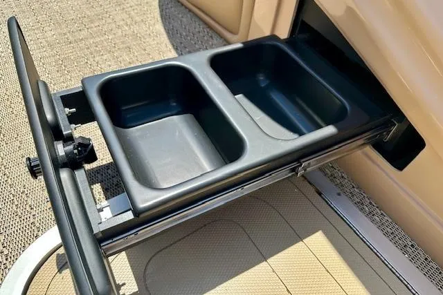 Slide: The Image of Pull-out storage bins in a 2026 Barletta L23UC boat interior. - 12