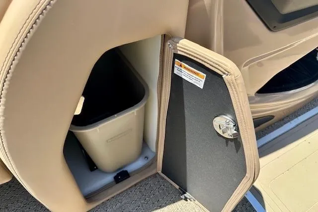 Slide: The Image of Storage compartment with trash bin in 2026 Barletta L23UC boat interior. - 17